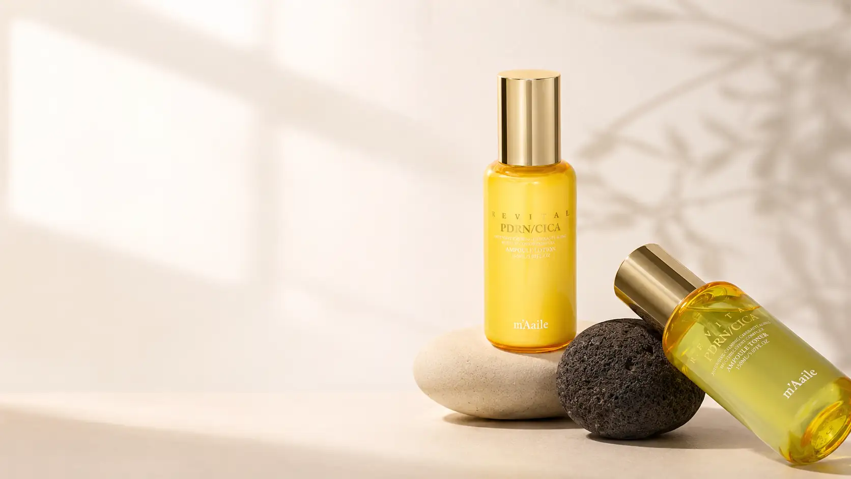 m'Aaile Revital Ampoule Lotion and Toner, built around PDRN and CICA, on a light editorial stone set